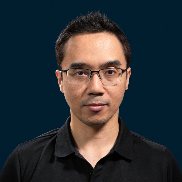 Portrait of Irwan Hanish in glasses and a dark shirt